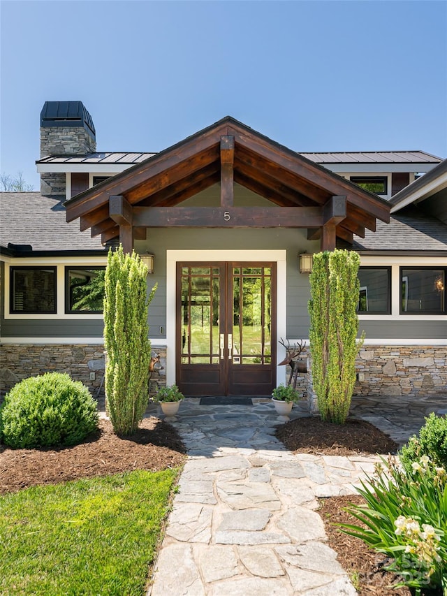 5 Bridgewater Dr, Fletcher, NC 28732 - doorway to property featuring french doors, stone siding, a standing seam roof, and a chimney