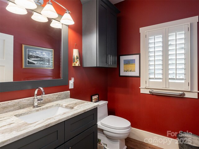 5 Bridgewater Dr, Fletcher, NC 28732 - bathroom featuring toilet, vanity, baseboards, and wood finished floors