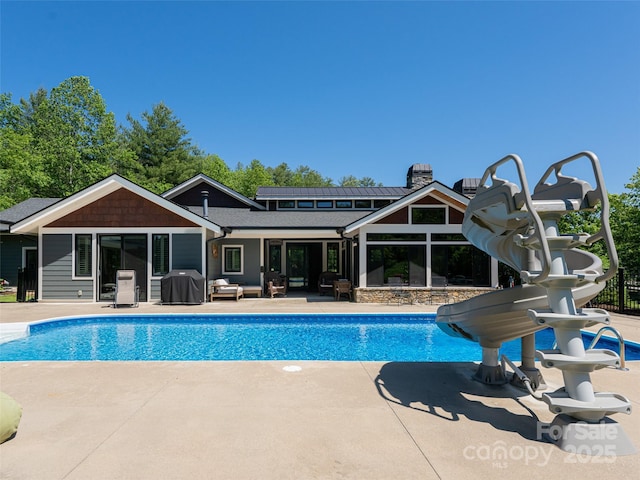 5 Bridgewater Dr, Fletcher, NC 28732 - outdoor pool featuring a water slide, an outdoor hangout area, a patio, and area for grilling