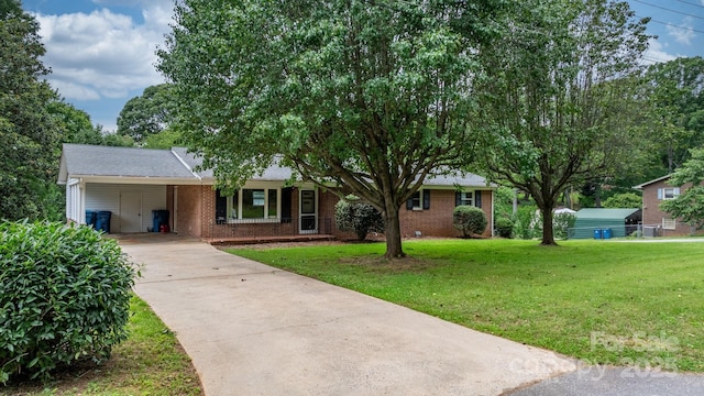 1753 28th St NE, Hickory, NC 28601 - ranch-style house with driveway, brick siding, a front lawn, and an attached carport