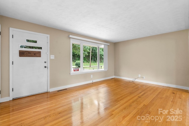 1753 28th St NE, Hickory, NC 28601 - foyer entrance with baseboards and light wood-style floors