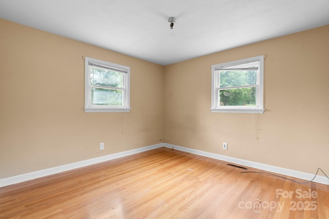 1753 28th St NE, Hickory, NC 28601 - empty room featuring baseboards and light wood-type flooring