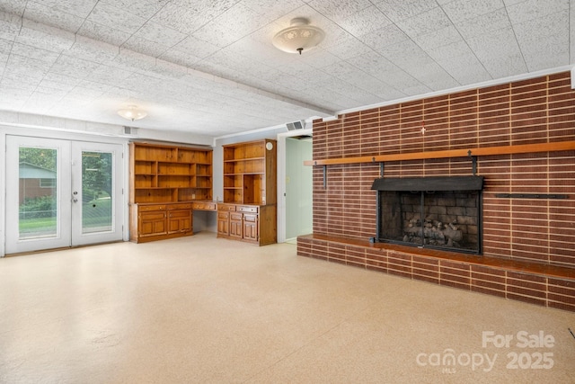 1753 28th St NE, Hickory, NC 28601 - unfurnished living room featuring a fireplace and french doors
