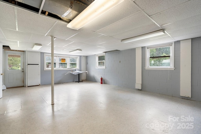 1753 28th St NE, Hickory, NC 28601 - basement featuring concrete block wall, a paneled ceiling, and plenty of natural light