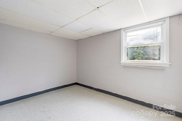 1753 28th St NE, Hickory, NC 28601 - unfurnished room featuring concrete block wall, a drop ceiling, and baseboards