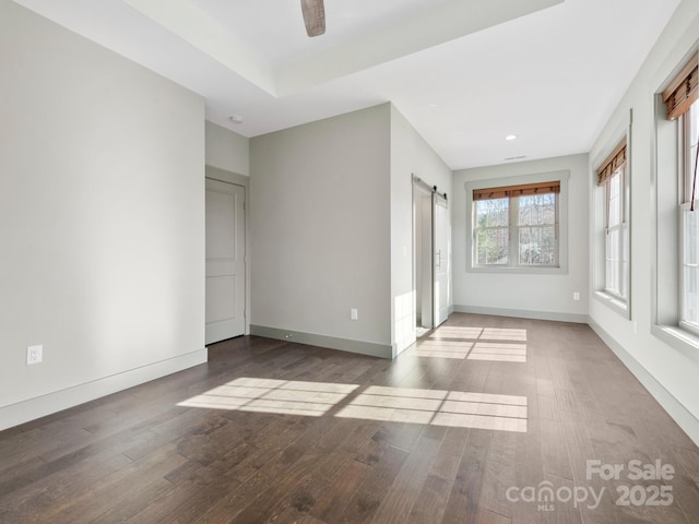 0 Welding Way Unit 128, Hendersonville, NC 28792 - spare room with a barn door, wood finished floors, baseboards, and recessed lighting