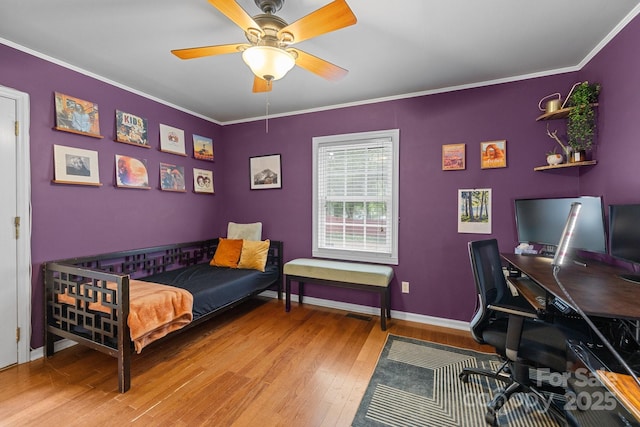 509 W Sixth Ave, Gastonia, NC 28052 - bedroom with wood finished floors, a desk, ornamental molding, baseboards, and a ceiling fan
