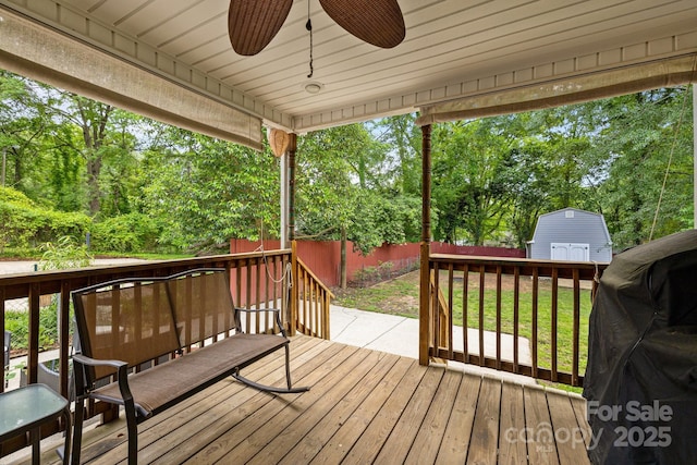 509 W Sixth Ave, Gastonia, NC 28052 - deck with a ceiling fan, an outbuilding, a storage unit, and a fenced backyard