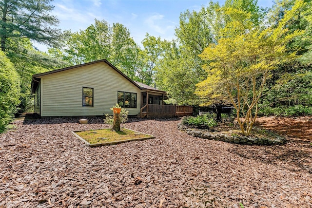 rear view of house with a sunroom