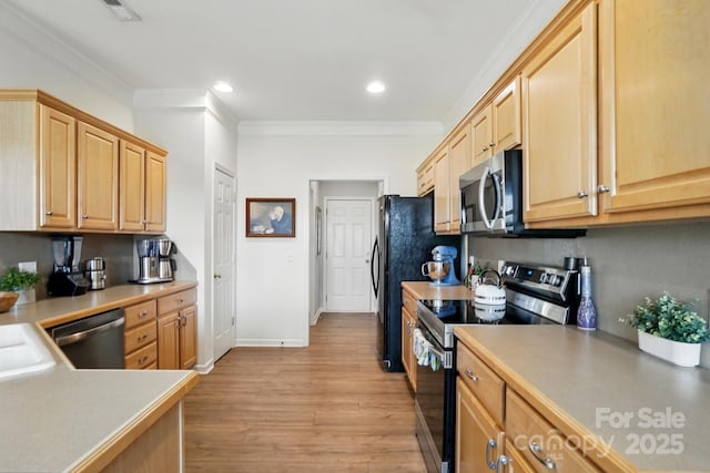 146 Burtons Barn Rd, Mooresville, NC 28115 - kitchen featuring appliances with stainless steel finishes, light wood-style flooring, crown molding, light brown cabinets, and recessed lighting