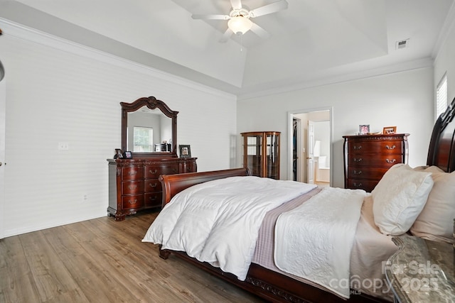 146 Burtons Barn Rd, Mooresville, NC 28115 - bedroom featuring a tray ceiling, multiple windows, wood finished floors, ceiling fan, and crown molding