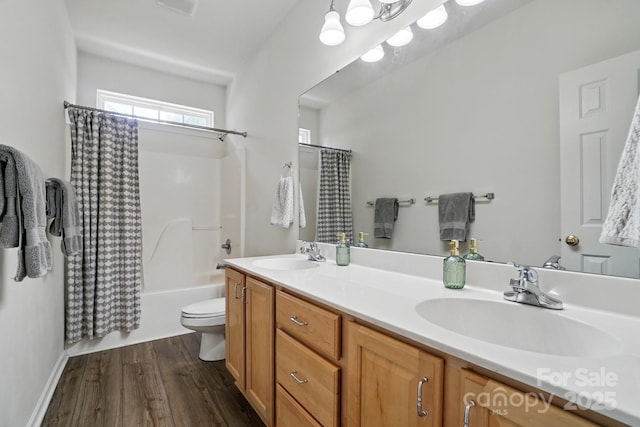 146 Burtons Barn Rd, Mooresville, NC 28115 - full bath featuring wood finished floors, double vanity, toilet, and shower / bath combo