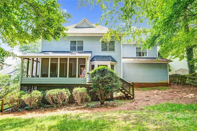 5238 Downing Creek Dr, Charlotte, NC 28269 - back of house with a sunroom, fence, and roof with shingles