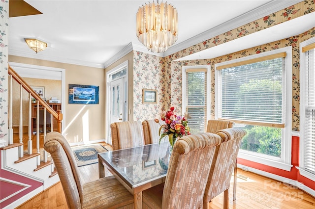 5238 Downing Creek Dr, Charlotte, NC 28269 - dining room featuring a chandelier, hardwood / wood-style flooring, crown molding, wallpapered walls, and stairway