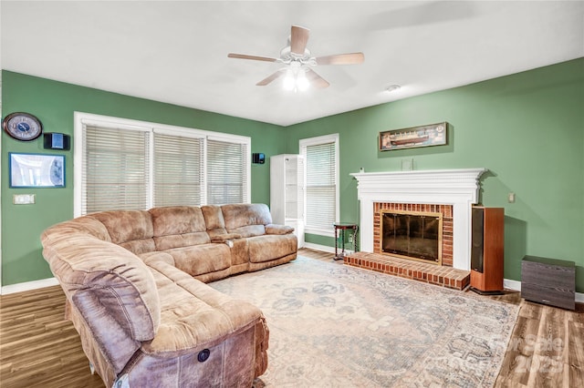 5238 Downing Creek Dr, Charlotte, NC 28269 - living area featuring baseboards, ceiling fan, wood finished floors, and a fireplace