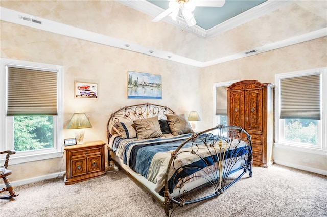 5238 Downing Creek Dr, Charlotte, NC 28269 - carpeted bedroom featuring baseboards, ornamental molding, multiple windows, and a ceiling fan