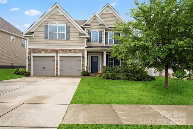 view of front of property with a garage, a front lawn, concrete driveway, and stone siding