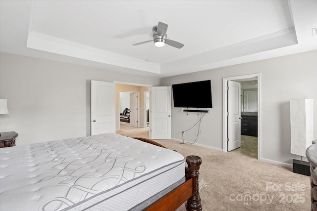 bedroom featuring a tray ceiling, light colored carpet, ornamental molding, and baseboards
