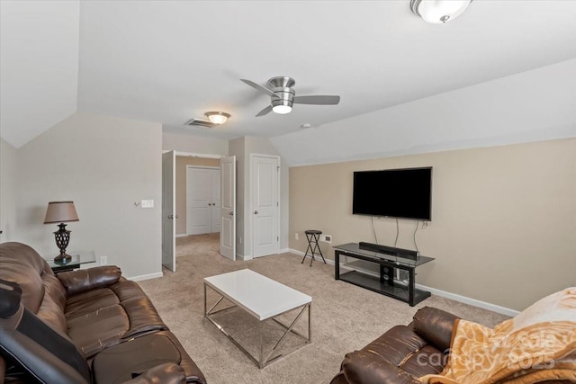 living room featuring lofted ceiling, light carpet, baseboards, and ceiling fan