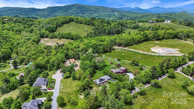 1925 Green Hill Rd, Blowing Rock, NC 28605 - aerial view of property and surrounding area featuring a mountain backdrop and a heavily wooded area