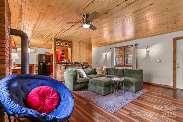 1925 Green Hill Rd, Blowing Rock, NC 28605 - living room with wooden ceiling, ceiling fan, wood finished floors, and a wall unit AC