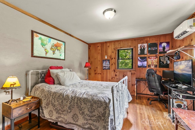 1925 Green Hill Rd, Blowing Rock, NC 28605 - bedroom with wood finished floors, an AC wall unit, ornamental molding, wood walls, and an office area