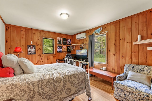 1925 Green Hill Rd, Blowing Rock, NC 28605 - bedroom with a wall mounted air conditioner, wood walls, and wood finished floors