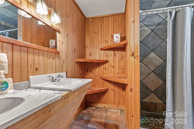 1925 Green Hill Rd, Blowing Rock, NC 28605 - full bathroom featuring wooden walls, stone finish floors, double vanity, and a tile shower