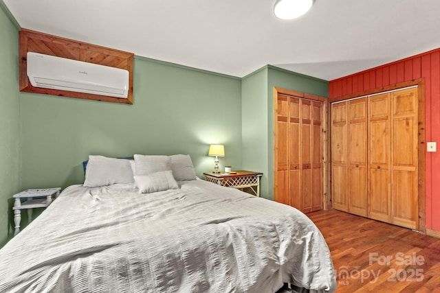 1925 Green Hill Rd, Blowing Rock, NC 28605 - bedroom with a wall unit AC, wood finished floors, and a closet