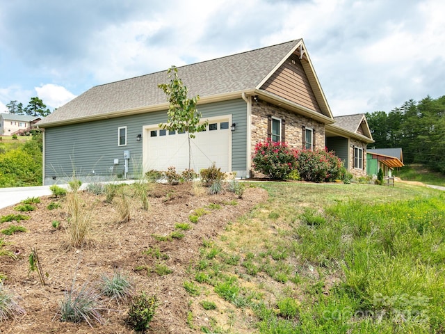 5 S Pine Dr, Weaverville, NC 28787 - view of property exterior with an attached garage, a shingled roof, and stone siding