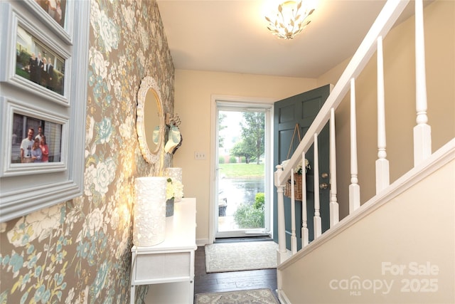 8306 Knights Bridge Rd, Charlotte, NC 28210 - foyer featuring wood finished floors, stairway, and baseboards