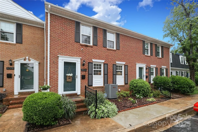 8306 Knights Bridge Rd, Charlotte, NC 28210 - view of front of house with central AC unit and brick siding