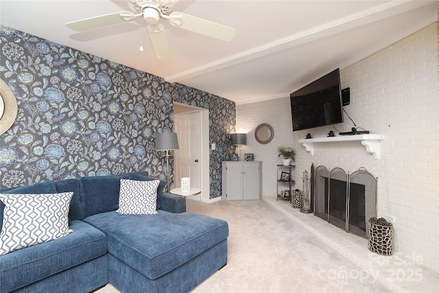 8306 Knights Bridge Rd, Charlotte, NC 28210 - carpeted living area with a brick fireplace, a ceiling fan, wallpapered walls, and beam ceiling