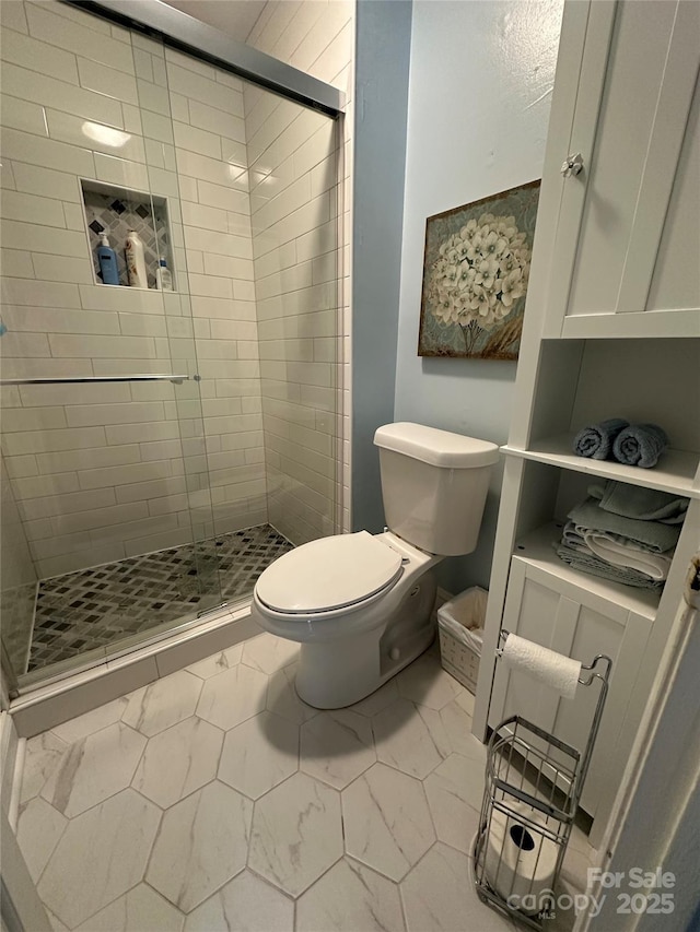 8306 Knights Bridge Rd, Charlotte, NC 28210 - full bath featuring a stall shower, toilet, and marble finish flooring