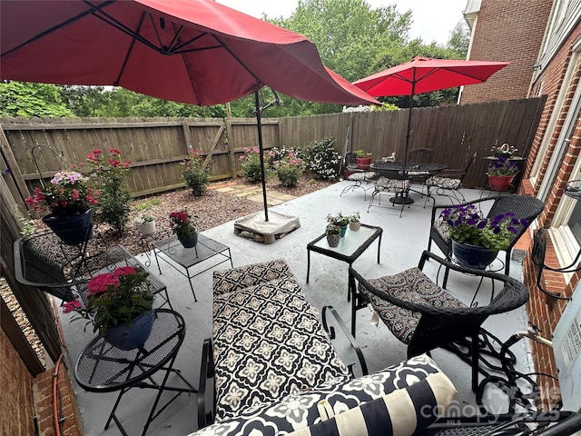 8306 Knights Bridge Rd, Charlotte, NC 28210 - view of patio / terrace featuring outdoor dining space, a fenced backyard, and outdoor lounge area