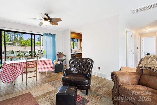 319 Greenville Hwy Unit 302, Brevard, NC 28712 - living area with wood finished floors, ceiling fan, and baseboards