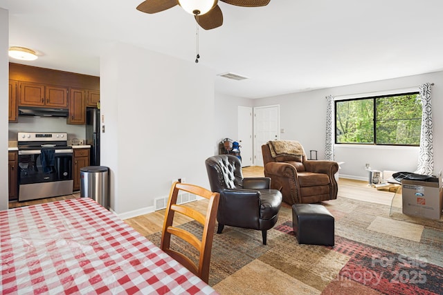 319 Greenville Hwy Unit 302, Brevard, NC 28712 - living room featuring light wood-style floors, ceiling fan, and baseboards