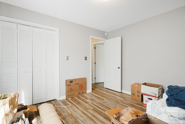 319 Greenville Hwy Unit 302, Brevard, NC 28712 - bedroom with light wood finished floors, baseboards, and a closet