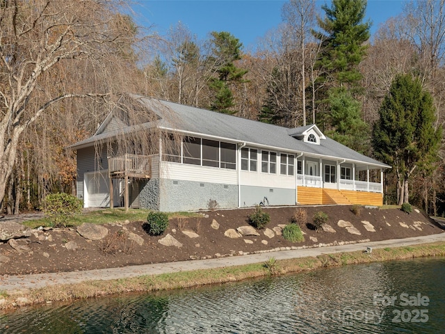 530 Stoney Mountain Rd, Hendersonville, NC 28791 - back of property with a sunroom, a water view, and an attached garage