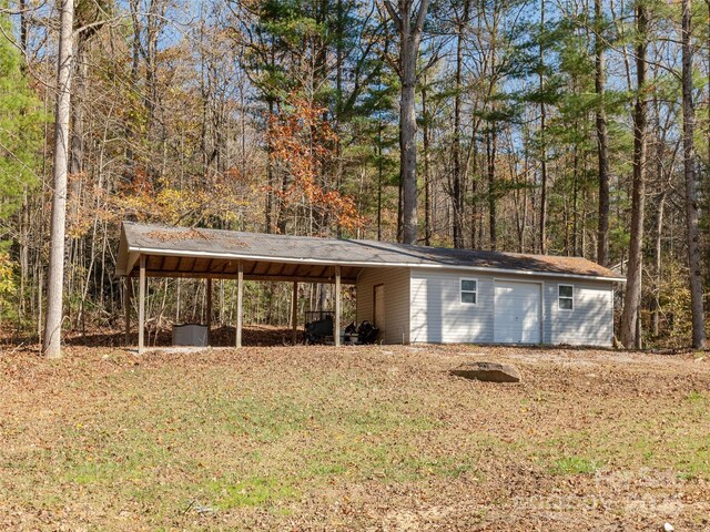 530 Stoney Mountain Rd, Hendersonville, NC 28791 - view of outdoor structure with a carport and a forest view