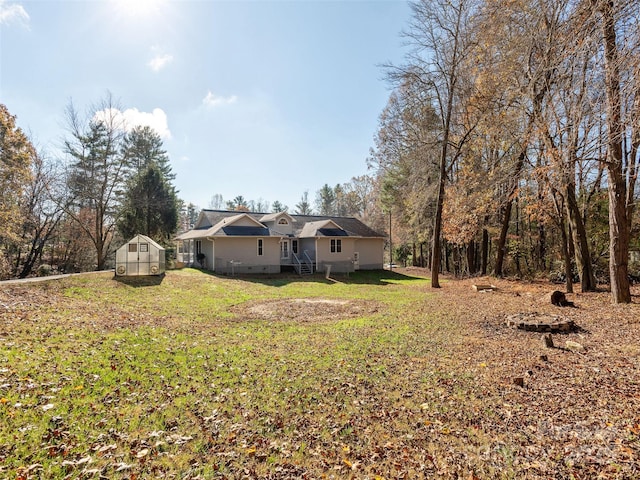 530 Stoney Mountain Rd, Hendersonville, NC 28791 - view of green lawn with a greenhouse and an outdoor structure