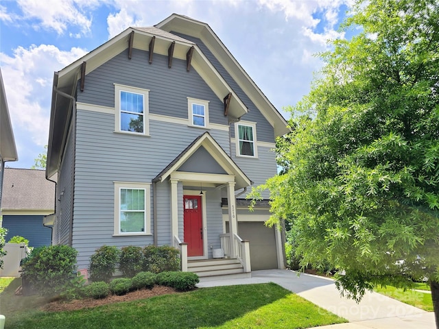 5210 Kelly St, Charlotte, NC 28205 - view of front of home featuring an attached garage, concrete driveway, and a front yard