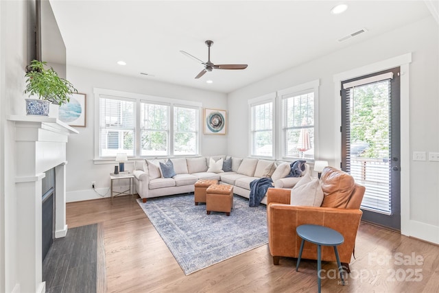 5210 Kelly St, Charlotte, NC 28205 - living area featuring a ceiling fan, baseboards, wood finished floors, a fireplace with flush hearth, and recessed lighting
