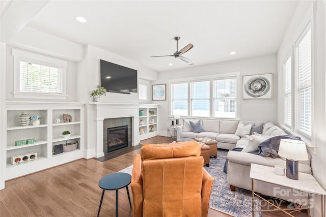 5210 Kelly St, Charlotte, NC 28205 - living area featuring a ceiling fan, wood finished floors, a fireplace with flush hearth, and recessed lighting