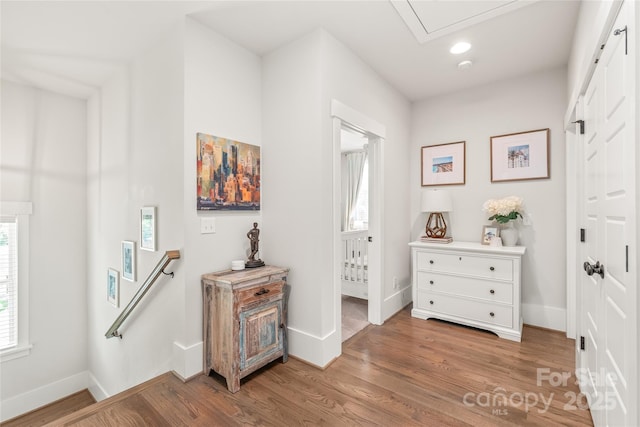 5210 Kelly St, Charlotte, NC 28205 - hallway featuring wood finished floors, baseboards, recessed lighting, an upstairs landing, and attic access