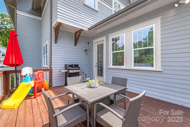 5210 Kelly St, Charlotte, NC 28205 - wooden deck with a grill and outdoor dining area