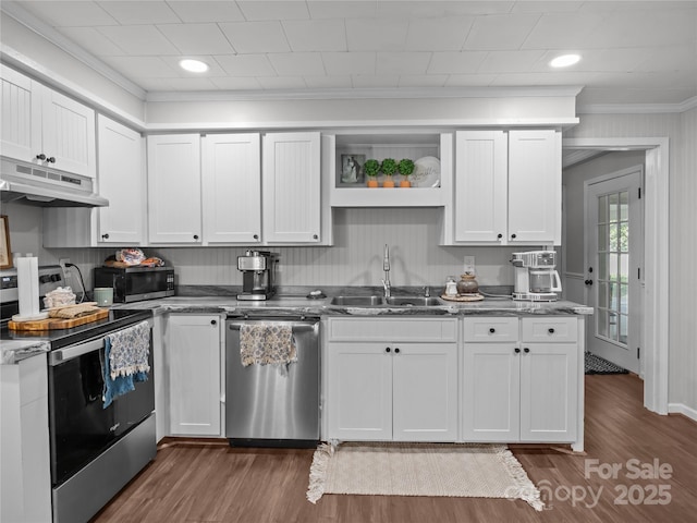 1544 US-221A Hwy, Mooresboro, NC 28114 - kitchen featuring appliances with stainless steel finishes, under cabinet range hood, a sink, crown molding, and white cabinetry
