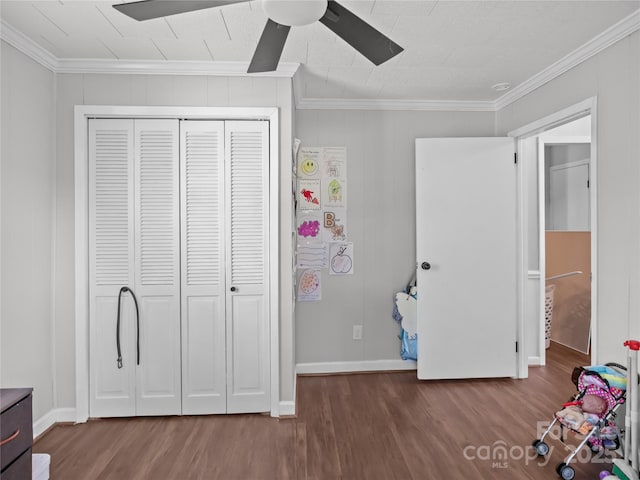 1544 US-221A Hwy, Mooresboro, NC 28114 - unfurnished bedroom with wood finished floors, ornamental molding, a closet, and baseboards