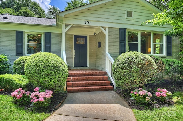 property entrance with brick siding