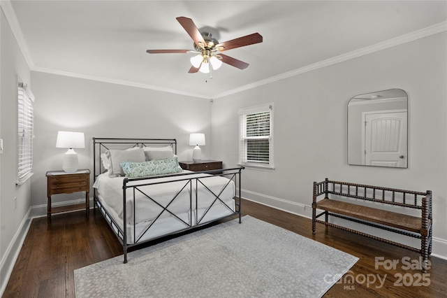 bedroom with ornamental molding, baseboards, wood finished floors, and a ceiling fan